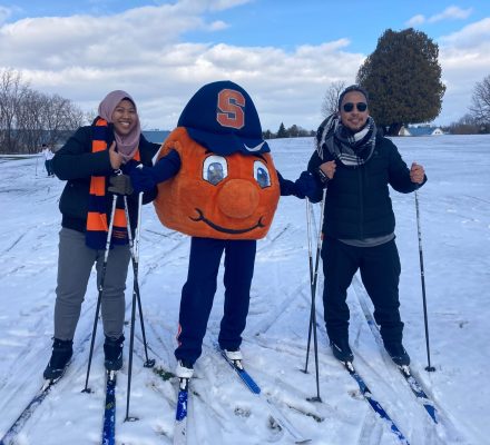 Syracuse University Barnes Center at The Arch and Drumlins Country Club Cross Country Ski and Snowshoe Center students during a winter outing with Otto.