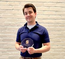 Tony Ruscitto holds undergraduate student employee of the year award