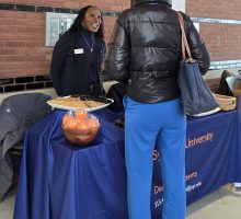 Syracuse University Dean Dixon talking with a student.