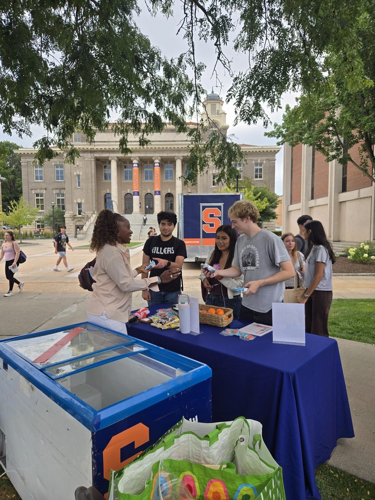 Dean Dixon handing out Ice Cream to students on the Quad at the Involvement Fair. 
