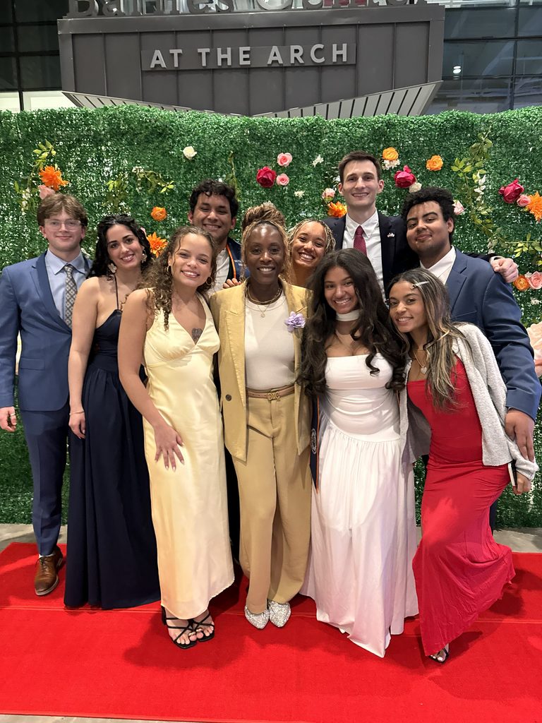 Dean Dixon with Students at an award ceremony 