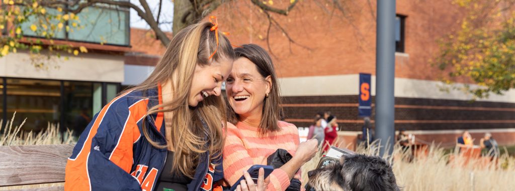 two women having a conversation and laughing