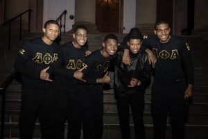 Picture of members of Alpha Phi Alpha Fraternity, Inc. infront of Hedrick's Chapel