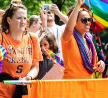 Campus community members march in an LGBTQ+ Pride Parade