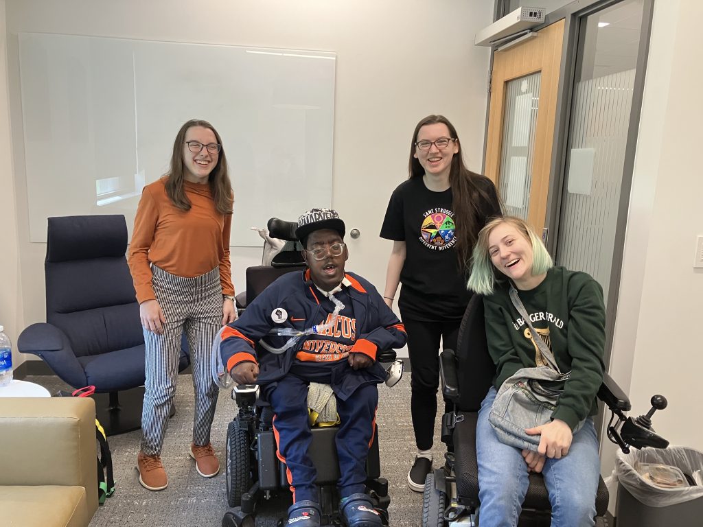 Four students posing for a picture.