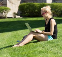 Syracuse University Student Using Laptop