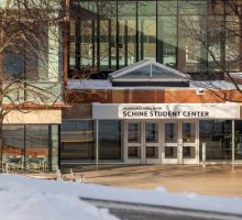 Exterior of Schine Student Center with snow on the ground