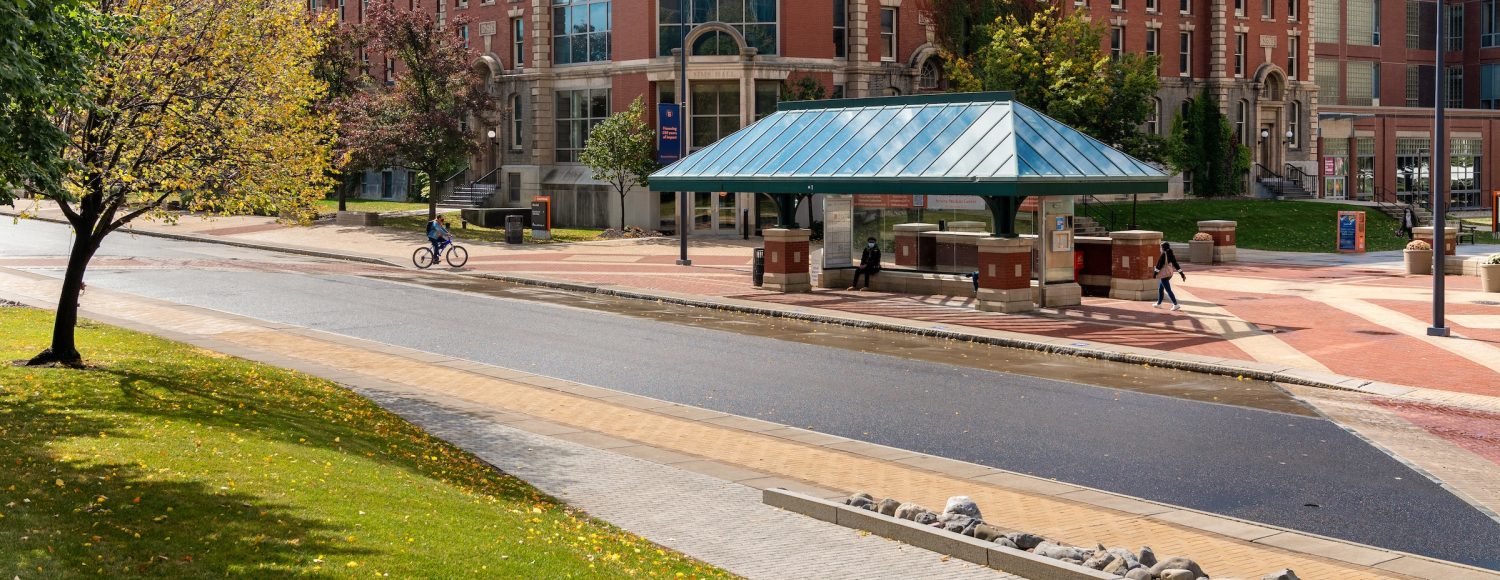 Photo of Sims Hall Exterior with College Place bus stop