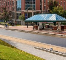 Photo of Sims Hall Exterior with College Place bus stop