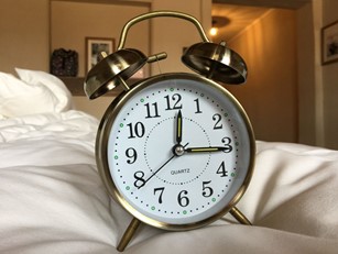 A classic brass alarm clock.