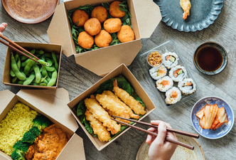 A table full of takeout boxes