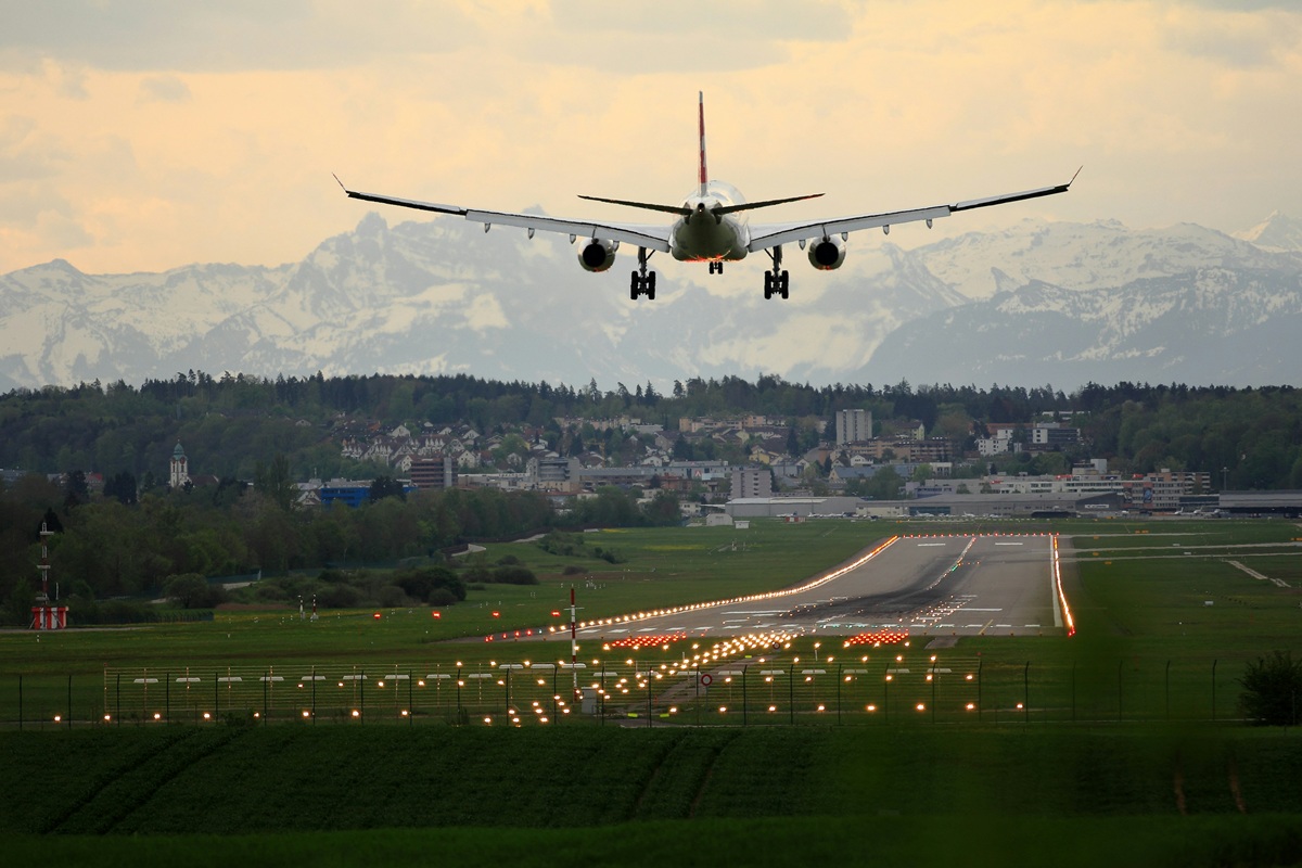A plane landing on a runway.