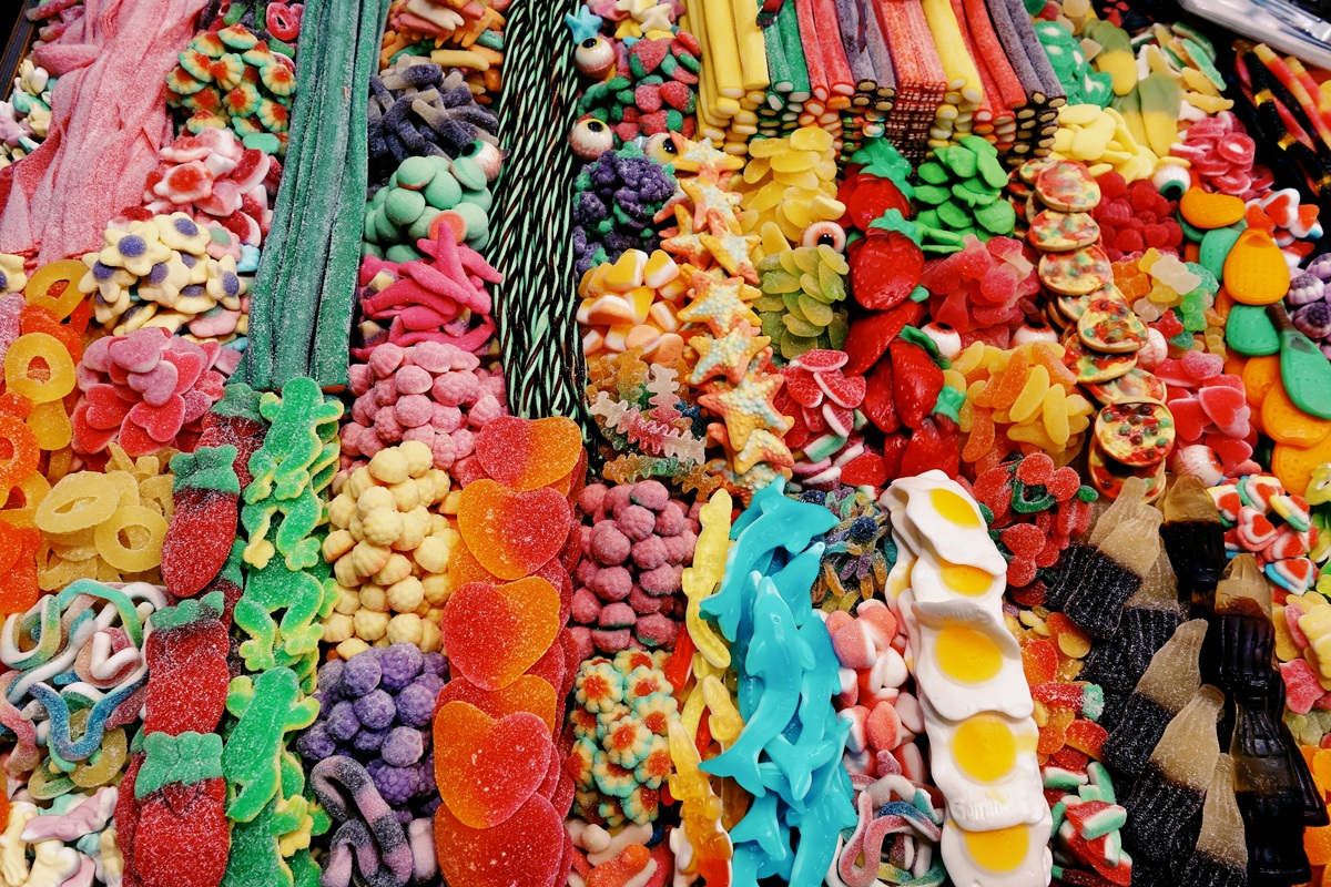 Rows of gummy candies in various shapes and colors.