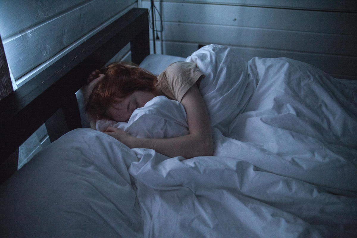 A person sleeping in bed.