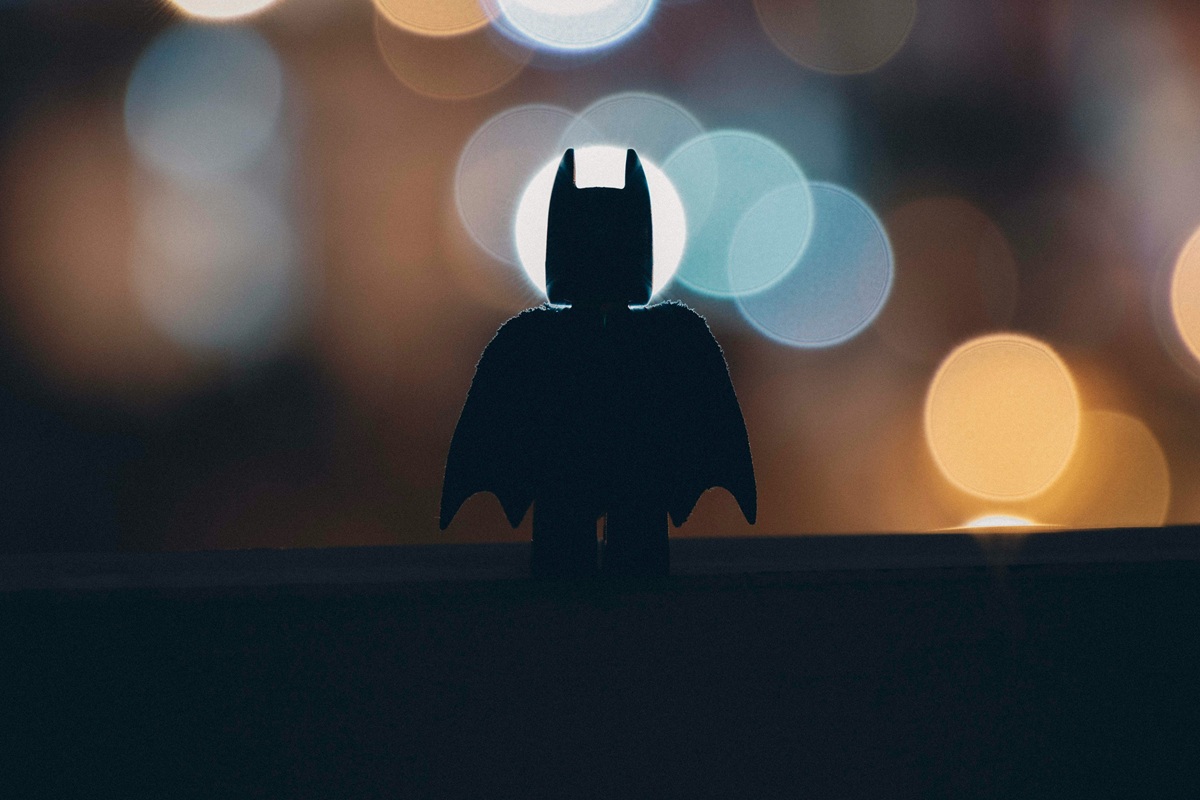 The silhouette of a Batman Lego figurine