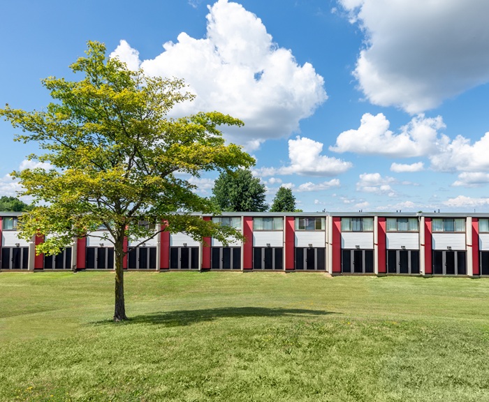 A row of South Campus apartments on a sunny spring day.