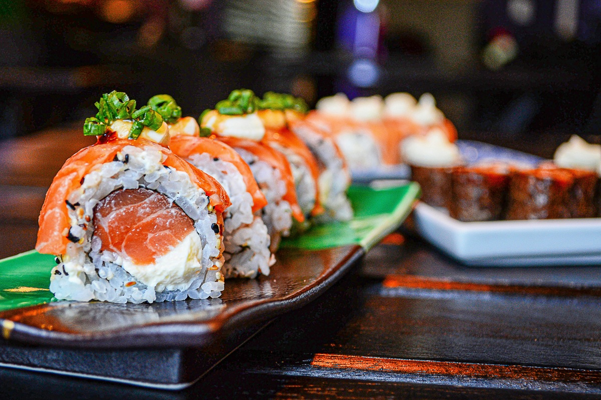 A salmon sushi roll on a plate