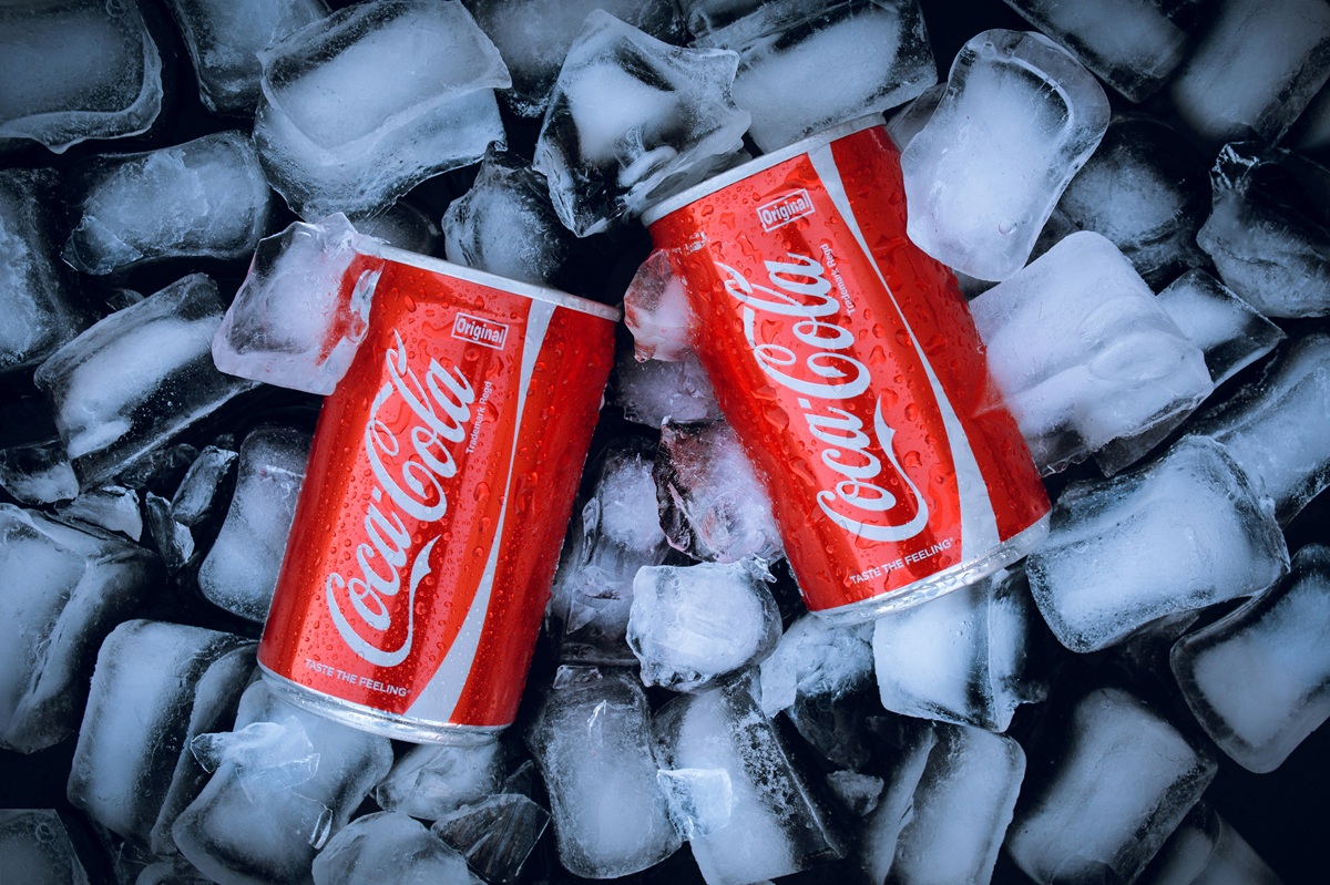 cans of coca cola on ice