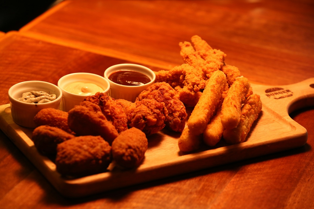 fried appetizers on a wooden board