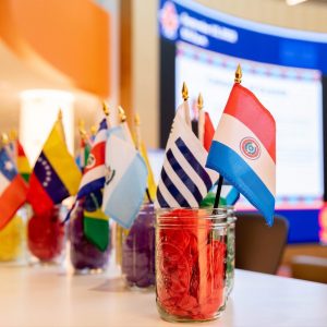 Flags representing Latin American countries on a table